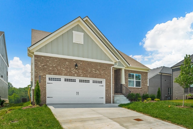1808 Riverside Rd, Old Hickory, TN 37138 - view of front of house with board and batten siding, brick siding, an attached garage, and driveway