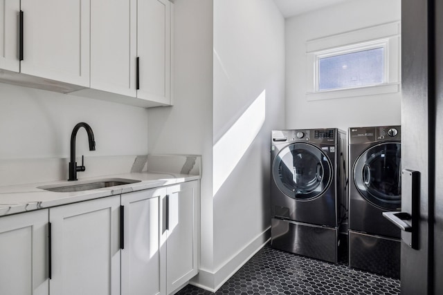 1514 Tyne Blvd, Nashville, TN 37215 - laundry area with washing machine and dryer, cabinet space, and dark tile patterned floors