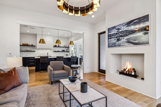 1514 Tyne Blvd, Nashville, TN 37215 - living room featuring light wood finished floors, a chandelier, recessed lighting, and wet bar