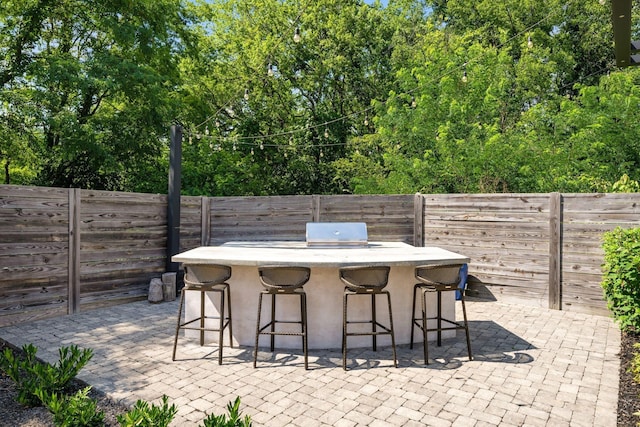 1514 Tyne Blvd, Nashville, TN 37215 - fenced backyard with a patio area, a grill, and view of scattered trees