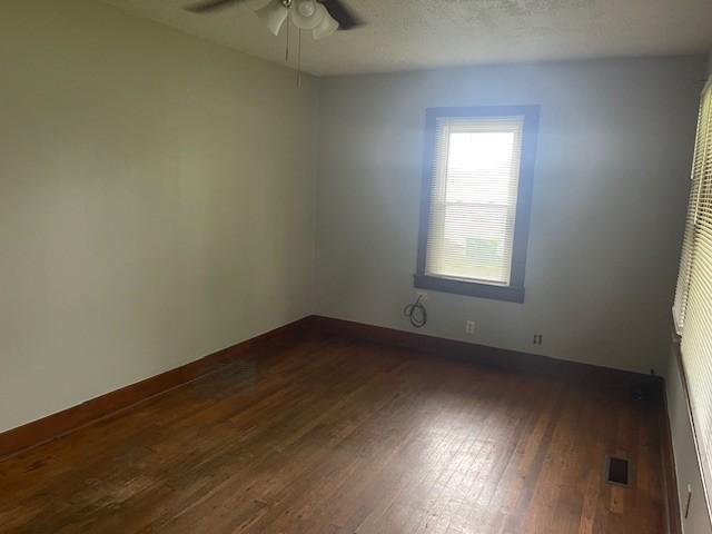 764 Center St, Lewisburg, TN 37091 - spare room with dark wood finished floors and a ceiling fan