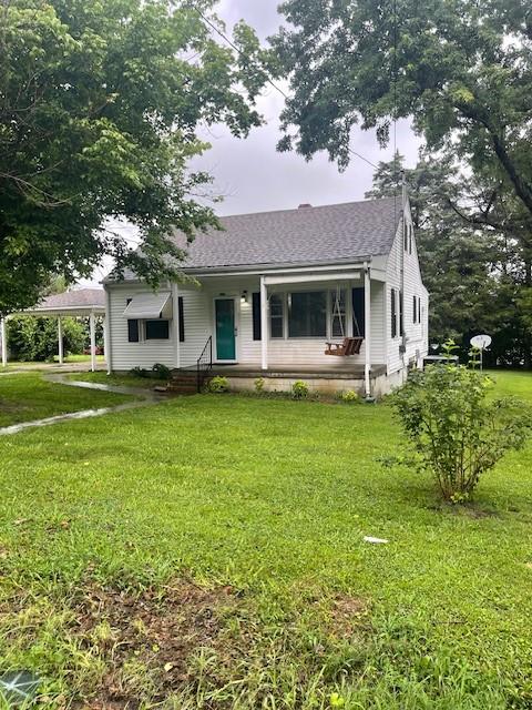 764 Center St, Lewisburg, TN 37091 - bungalow-style home featuring a shingled roof and a front yard