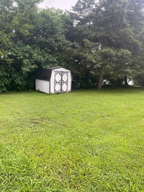 764 Center St, Lewisburg, TN 37091 - view of green lawn featuring a shed
