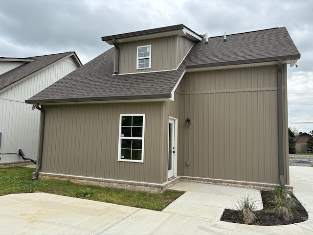 696 Castle Heights Ave, Lebanon, TN 37087 - rear view of house featuring roof with shingles and a patio