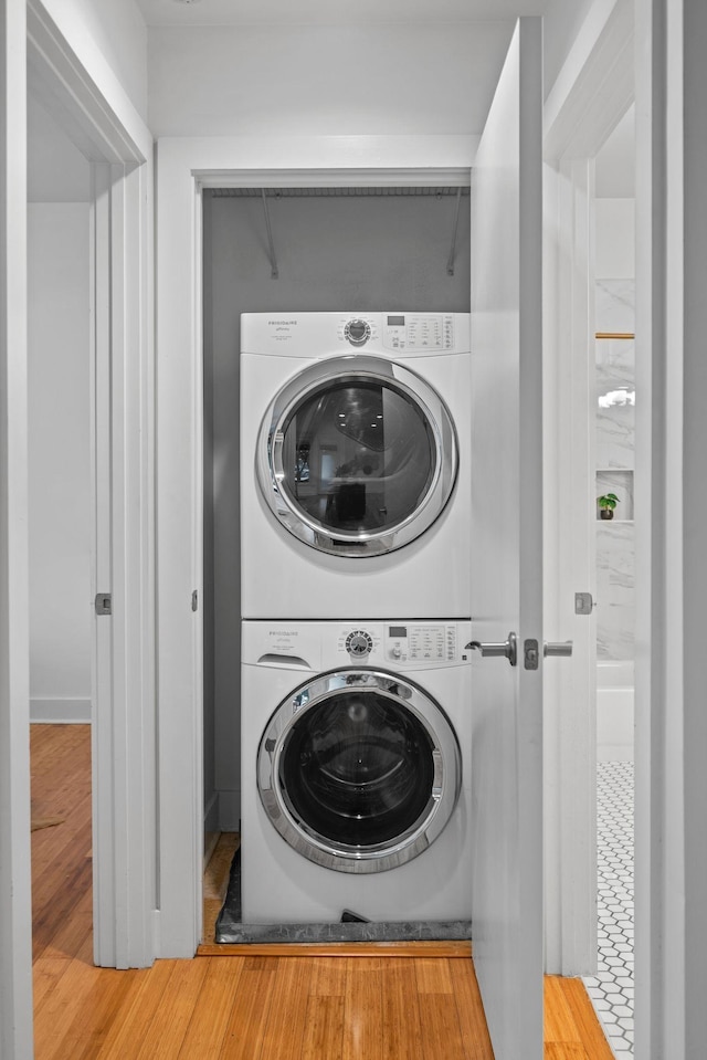 201 S 11th St, Nashville, TN 37206 - laundry area featuring stacked washing machine and dryer and wood finished floors