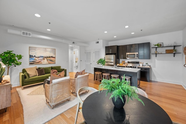 201 S 11th St, Nashville, TN 37206 - dining area with recessed lighting and light wood-style floors
