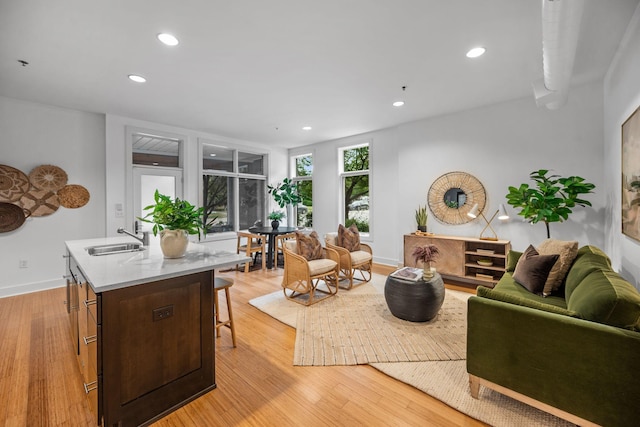 201 S 11th St, Nashville, TN 37206 - living area featuring light wood finished floors and recessed lighting