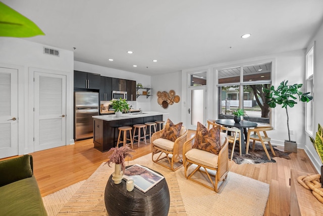 201 S 11th St, Nashville, TN 37206 - living room featuring light wood-style flooring and recessed lighting