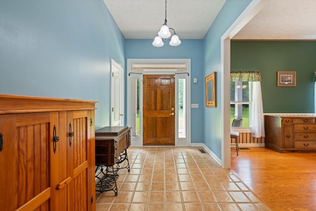 191 Spicer Rd, Burns, TN 37029 - foyer featuring a chandelier and light tile patterned floors