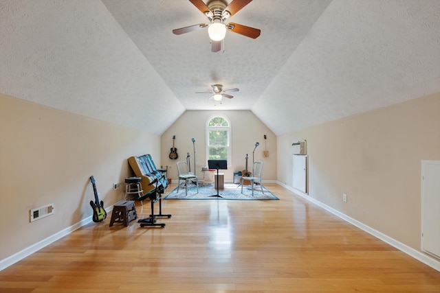191 Spicer Rd, Burns, TN 37029 - exercise area with light wood-style floors, a textured ceiling, a ceiling fan, and vaulted ceiling