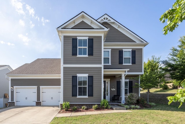 1719 Biscayne Dr, Franklin, TN 37067 - view of front of house with a garage, driveway, a front yard, and covered porch