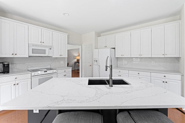 4016 Brandywine Pointe Blvd, Old Hickory, TN 37138 - kitchen featuring white appliances, a kitchen breakfast bar, and white cabinets