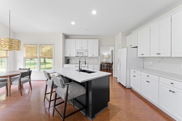 4016 Brandywine Pointe Blvd, Old Hickory, TN 37138 - kitchen with white appliances, healthy amount of natural light, a breakfast bar, backsplash, and recessed lighting
