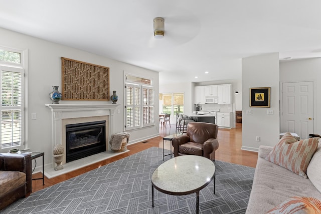 4016 Brandywine Pointe Blvd, Old Hickory, TN 37138 - living area with a ceiling fan, a glass covered fireplace, and light wood-style floors