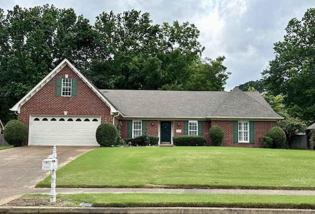 369 Bradford Trail Cv, Collierville, TN 38017 - view of front of property with driveway, brick siding, a front yard, and a shingled roof