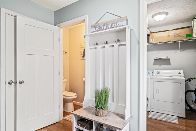 258 Green Meadow Dr, Smithville, TN 37166 - laundry room with wood finished floors, washing machine and clothes dryer, and a textured ceiling