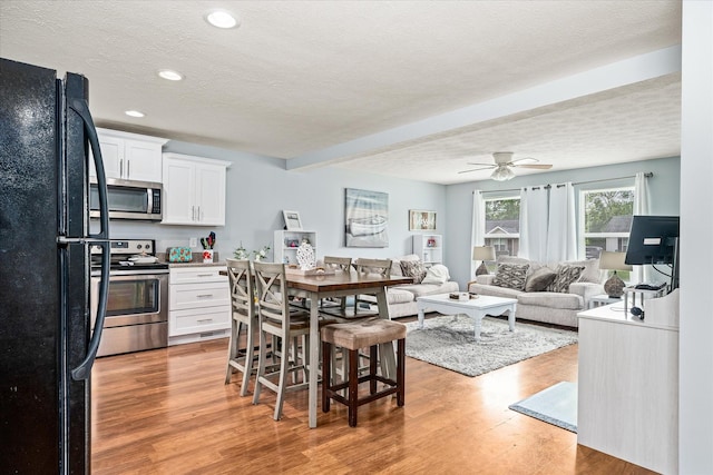 258 Green Meadow Dr, Smithville, TN 37166 - dining room featuring light wood-style flooring, ceiling fan, beam ceiling, a textured ceiling, and recessed lighting