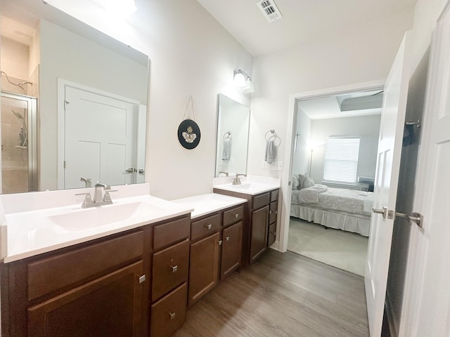 101 Percheron Pl, Smyrna, TN 37167 - ensuite bathroom with double vanity, a shower stall, and wood finished floors