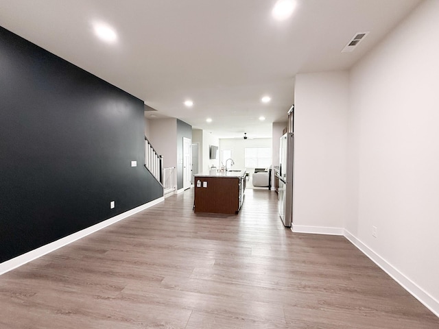 101 Percheron Pl, Smyrna, TN 37167 - unfurnished living room with recessed lighting, dark wood-style floors, and stairs