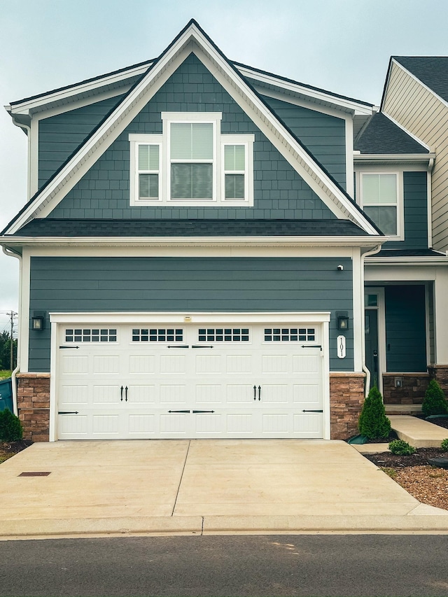 101 Percheron Pl, Smyrna, TN 37167 - craftsman-style home with stone siding, concrete driveway, and an attached garage