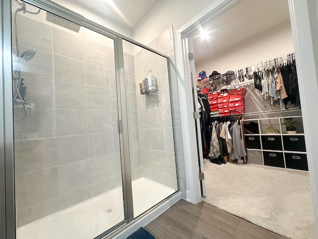 101 Percheron Pl, Smyrna, TN 37167 - bathroom with a stall shower, wood finished floors, and a walk in closet