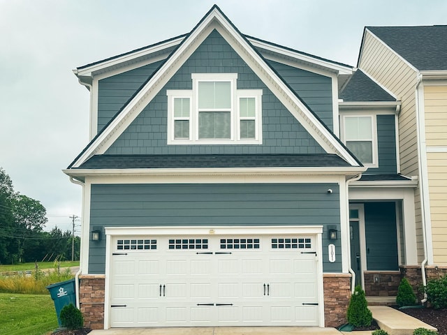 101 Percheron Pl, Smyrna, TN 37167 - craftsman-style home with stone siding, concrete driveway, an attached garage, and a shingled roof