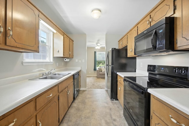 1812 Carneal Ln, Oak Grove, KY 42262 - kitchen with black appliances, light countertops, ceiling fan, and brown cabinets