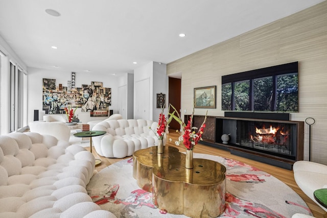 1091 Lynnwood Blvd, Nashville, TN 37215 - living room featuring wood finished floors, a warm lit fireplace, healthy amount of natural light, and recessed lighting