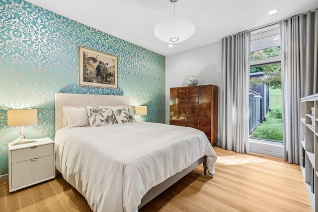 1091 Lynnwood Blvd, Nashville, TN 37215 - bedroom with wallpapered walls, light wood finished floors, multiple windows, and recessed lighting