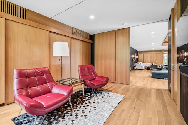 1091 Lynnwood Blvd, Nashville, TN 37215 - living area featuring light wood finished floors, wood walls, and recessed lighting