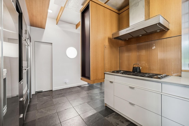 1091 Lynnwood Blvd, Nashville, TN 37215 - kitchen with wall chimney range hood, stainless steel appliances, white cabinets, light countertops, and modern cabinets