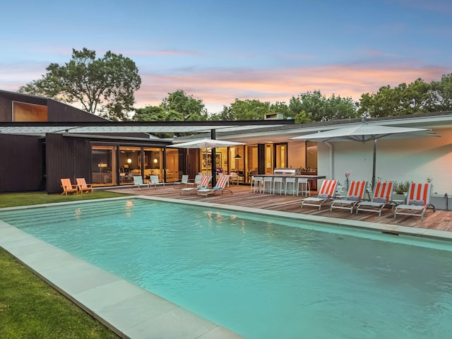 1091 Lynnwood Blvd, Nashville, TN 37215 - pool at dusk featuring an outdoor pool, a patio, and outdoor dining area