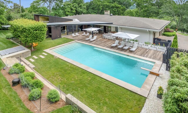 1091 Lynnwood Blvd, Nashville, TN 37215 - outdoor pool featuring a wooden deck, a diving board, and view of wooded area