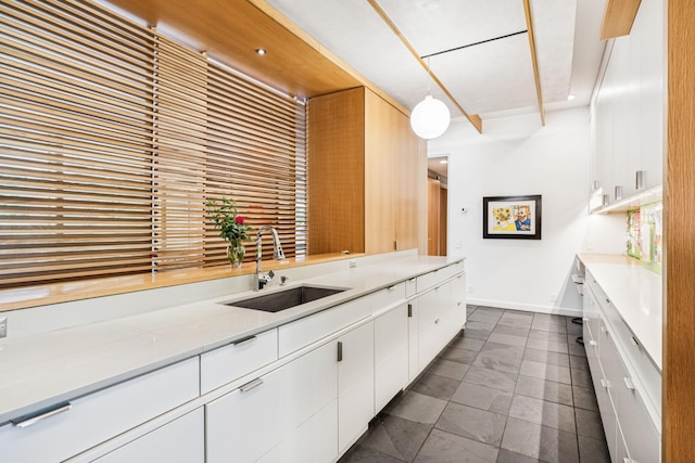 1091 Lynnwood Blvd, Nashville, TN 37215 - kitchen featuring white cabinetry, light countertops, hanging light fixtures, and dark tile patterned flooring
