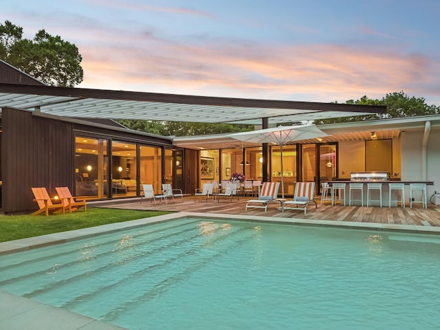 1091 Lynnwood Blvd, Nashville, TN 37215 - pool at dusk featuring an outdoor pool and a patio