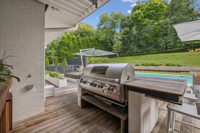 1091 Lynnwood Blvd, Nashville, TN 37215 - view of patio featuring a wooden deck, a grill, and view of wooded area