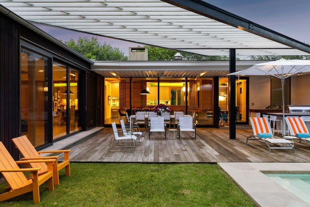 1091 Lynnwood Blvd, Nashville, TN 37215 - deck at dusk featuring a pergola, a yard, and outdoor dining space