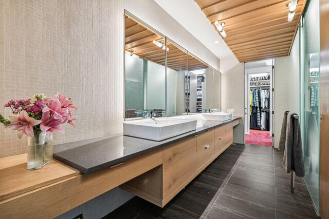 1091 Lynnwood Blvd, Nashville, TN 37215 - bathroom with double vanity, wooden ceiling, tile patterned floors, and a spacious closet