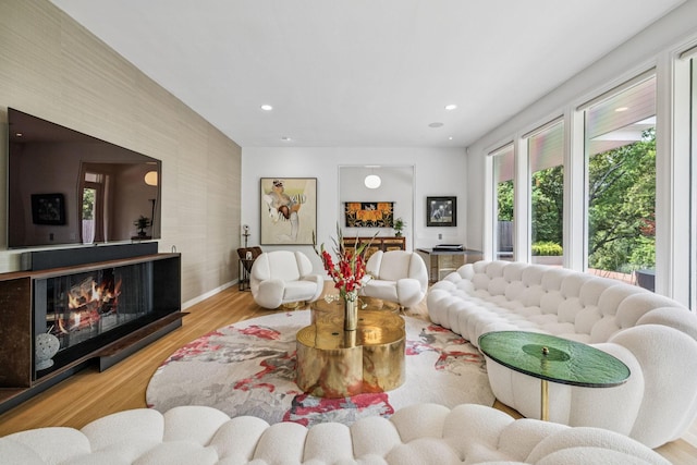 1091 Lynnwood Blvd, Nashville, TN 37215 - living room featuring wood finished floors, recessed lighting, and a warm lit fireplace