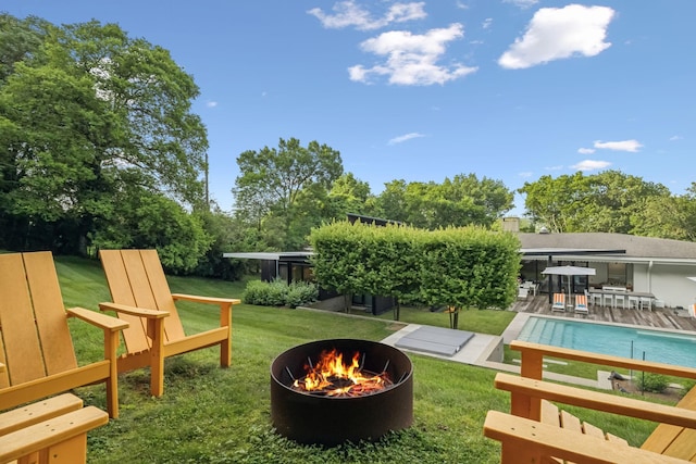 1091 Lynnwood Blvd, Nashville, TN 37215 - view of grassy yard featuring an outdoor fire pit, an outdoor pool, and a wooden deck
