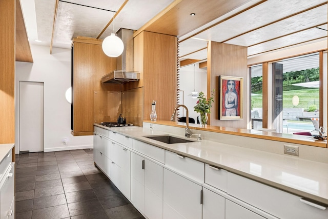 1091 Lynnwood Blvd, Nashville, TN 37215 - kitchen featuring wall chimney range hood, light countertops, pendant lighting, and white cabinets