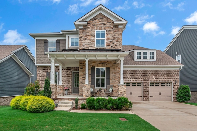 1074 Amelia Park Dr, Franklin, TN 37067 - view of front of home with covered porch, driveway, roof with shingles, stone siding, and brick siding