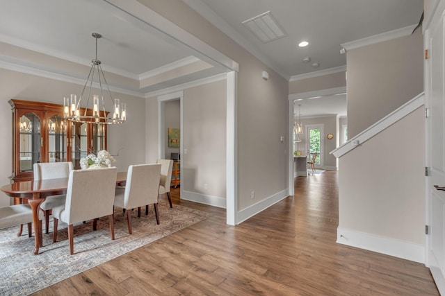 1074 Amelia Park Dr, Franklin, TN 37067 - dining space with a chandelier, wood finished floors, recessed lighting, and ornamental molding