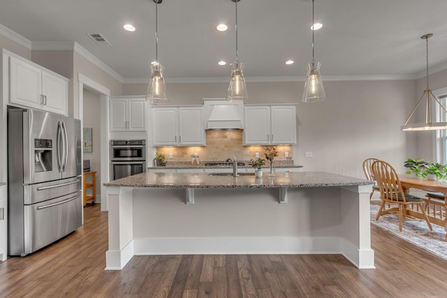 1074 Amelia Park Dr, Franklin, TN 37067 - kitchen with appliances with stainless steel finishes, custom range hood, decorative backsplash, white cabinets, and stone countertops
