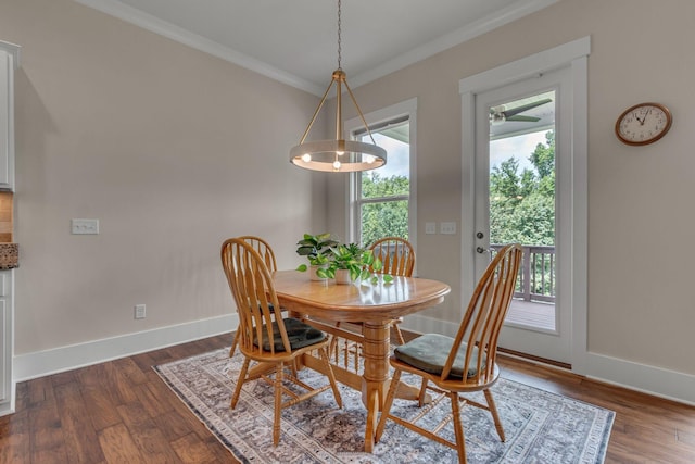 1074 Amelia Park Dr, Franklin, TN 37067 - dining area with dark wood-style flooring and crown molding
