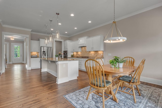 1074 Amelia Park Dr, Franklin, TN 37067 - dining area with recessed lighting, wood finished floors, and crown molding