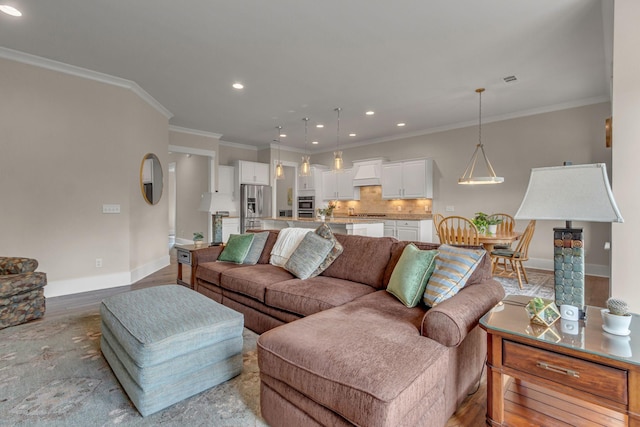 1074 Amelia Park Dr, Franklin, TN 37067 - living room with recessed lighting, ornamental molding, and light wood-style flooring