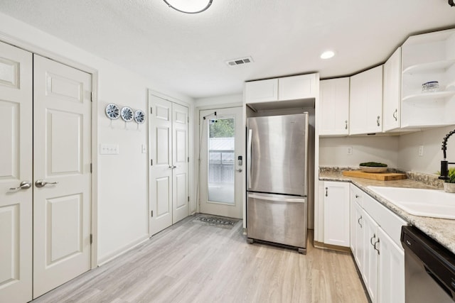 617 Still Point Rd, Smithville, TN 37166 - kitchen featuring freestanding refrigerator, dishwasher, light wood-type flooring, open shelves, and recessed lighting