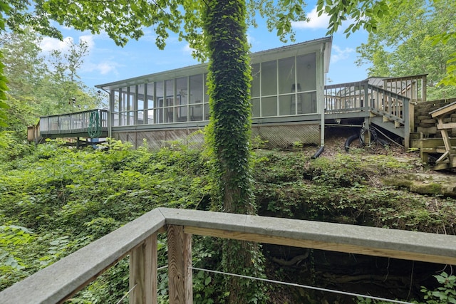 617 Still Point Rd, Smithville, TN 37166 - rear view of property featuring a sunroom, a wooden deck, and stairway