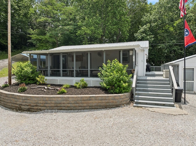 617 Still Point Rd, Smithville, TN 37166 - view of front of home featuring a sunroom, a metal roof, and a wooden deck